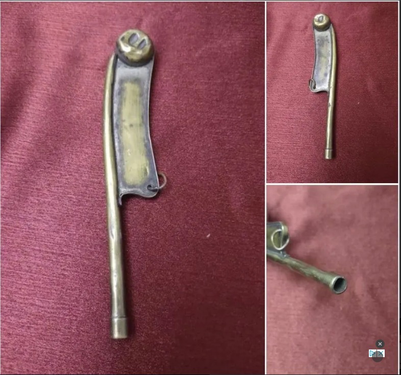 This Dull Bladed Brass Piece With Hollow Handle And “Balls” on Top